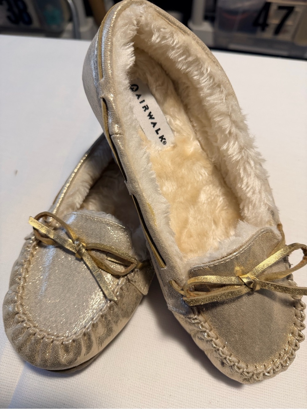 🔹Air walk..Flurry Moccasin Slip-OnDesign: Shimmery, metallic gold exterior